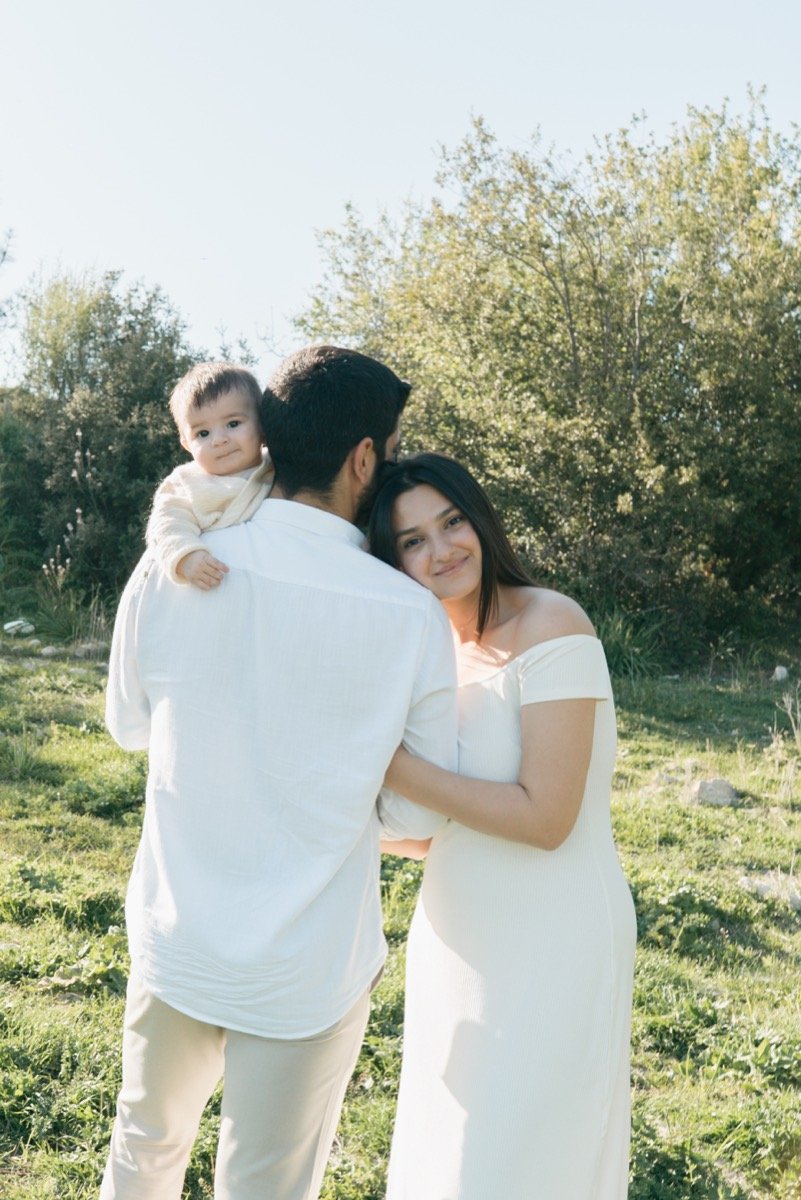 A family standing together outdoors